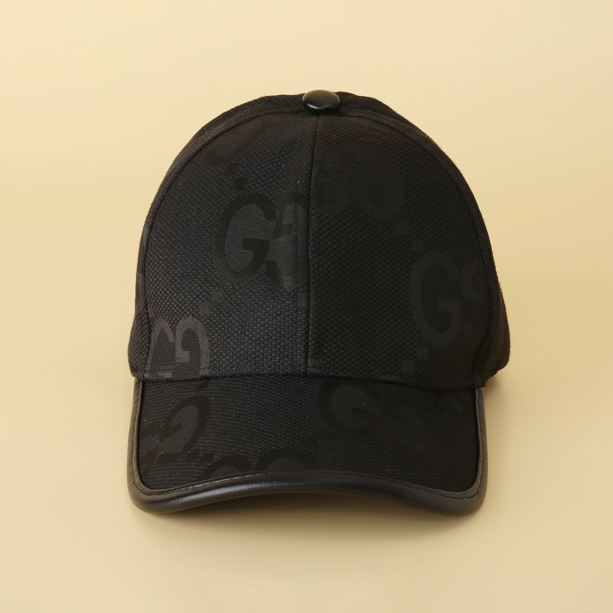 Sleek Black 'GG' Pattern Cap - Textured Design & Faux Leather Brim